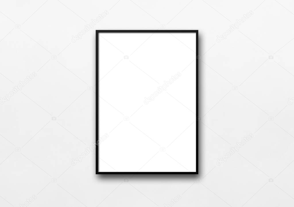 Black picture frame hanging on a white wall. Blank mockup template