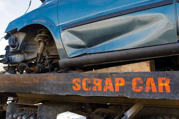 Recycling scrap car removal service for future dismantling and metal and parts reuse. — Stock Photo, Image
