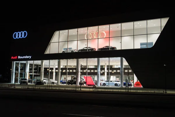 Vancouver BC, Canada - January 9, 2018: Office of official dealer Audi. Audi is a German automobile manufacturer specializing in high-performance and luxury cars. Night shot all is illuminated. — Stock Photo, Image