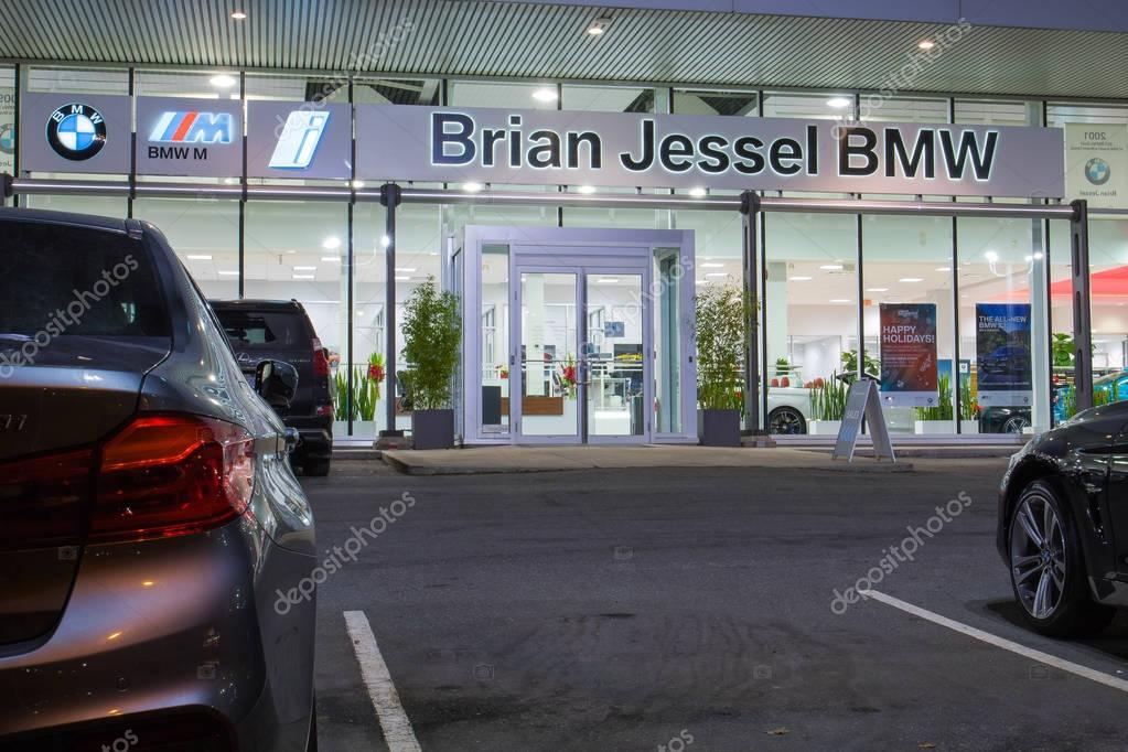 Vancouver BC, Canada - January 9, 2018: Office of official dealer BMW. BMW is a German automobile manufacturer specializing in high-performance and luxury cars. Night shot all is illuminated.