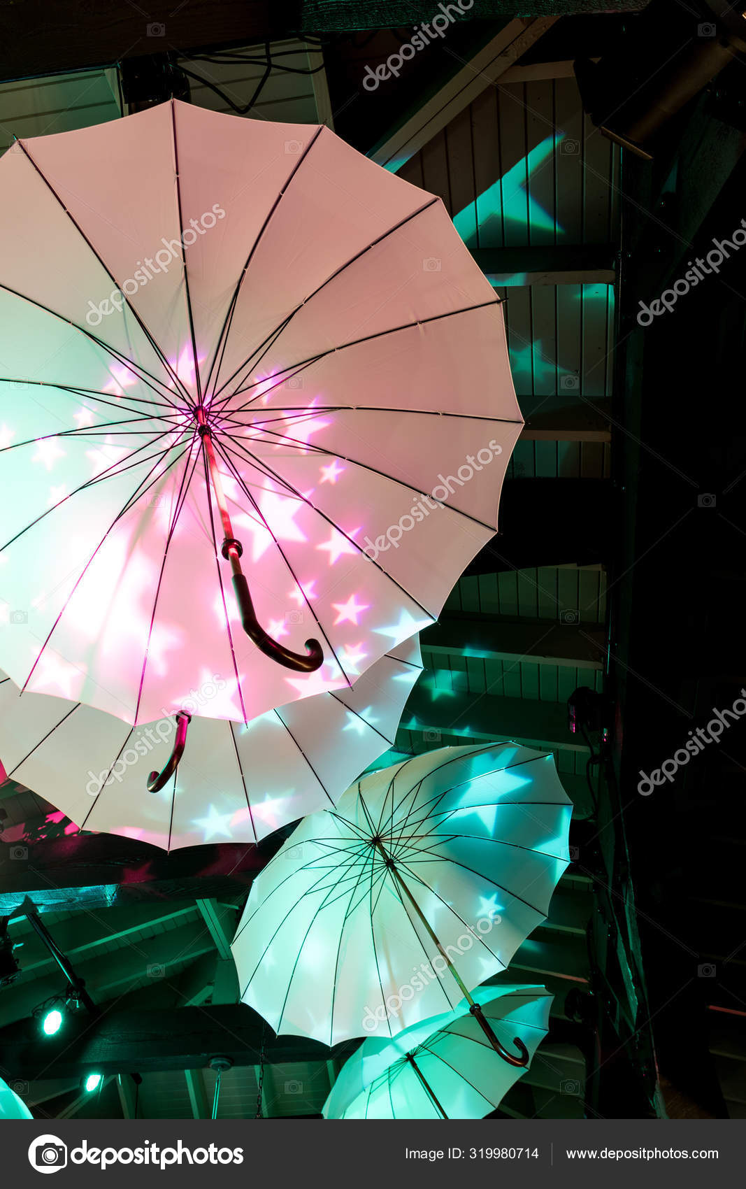 Colorful Umbrellas Hanging Under The Ceiling Light Up With