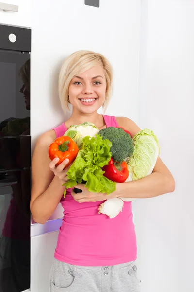 Woman raw fresh vegetables refrigerator — Stock Photo, Image