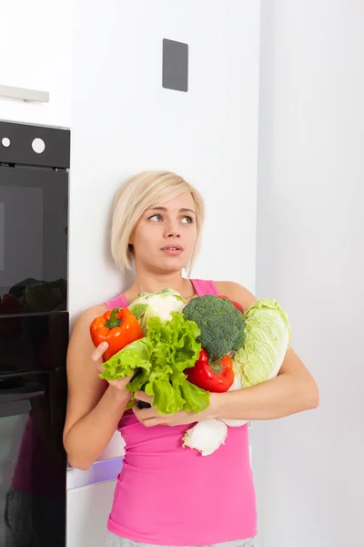 Unhappy woman raw fresh vegetables refrigerator — Stock Photo, Image