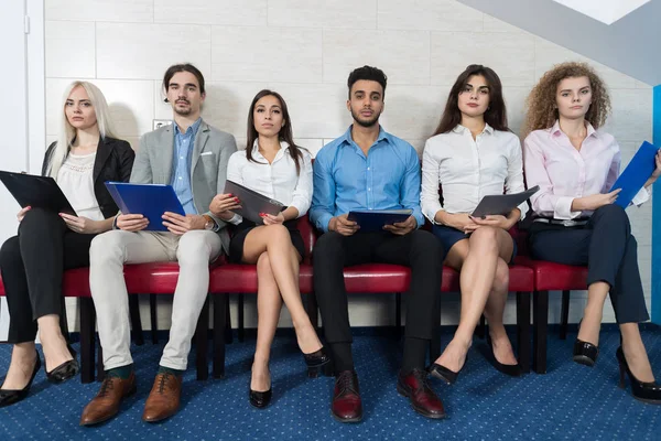 stock image Tired Candidates Wait For Job Interview, Mix Race Business People Sitting In Line Human Resources