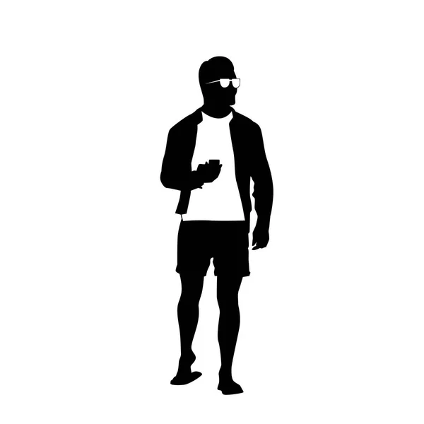 Чоловік Чорний силует Використовуйте мобільний смартфон стоїть на повну довжину над білим тлом — стоковий вектор