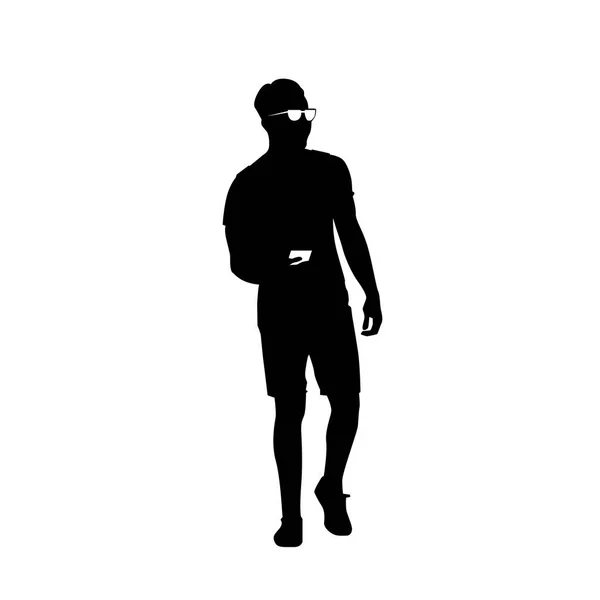 Muž černá silueta použití chytrý mobil stojící po celé délce nad bílým pozadím — Stockový vektor