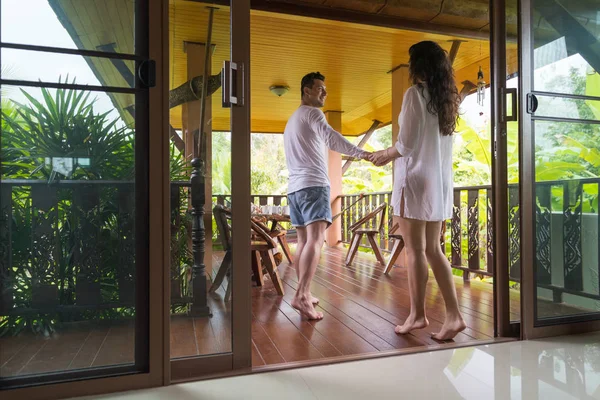 Young Couple On Terrace Tropical Hotel, Man And Woman Tropic Holiday Vacation