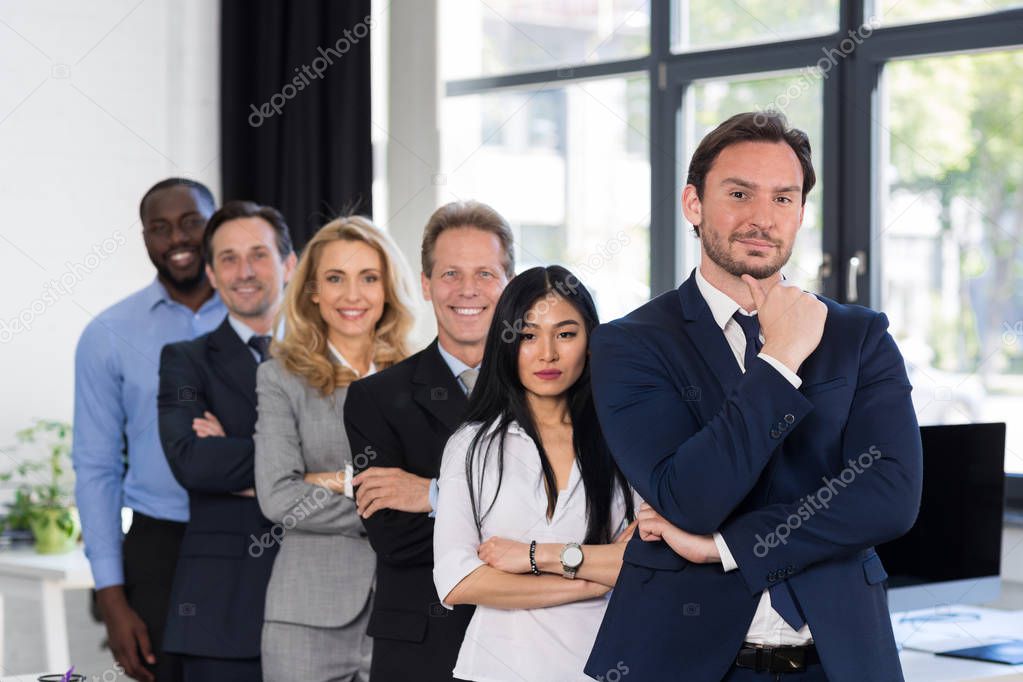 Group Of Businesspeople In Creative Office With Male Leader On Foreground Businessmen And Businesswomen Successful Team Mix Race Business People