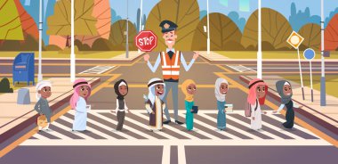 Policeman Guard Helping Group Of Arab School Children To Cross Road On Crosswalk clipart