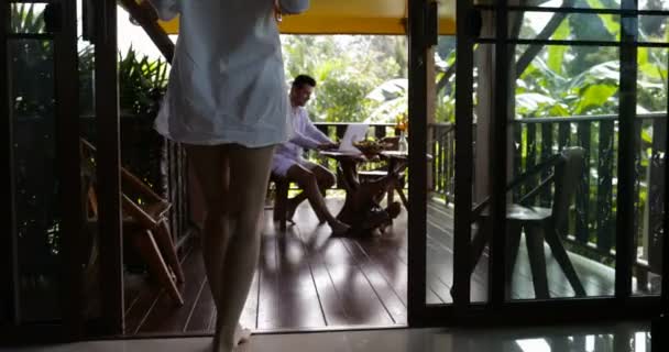 Young Woman Walking To Man Using Laptop On Summer Terrace, Beautiful Couple Surfing Web Together Outdoors — Stock Video