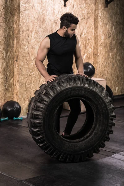 Sport Fitness Man Flipping Wheel Tire Crossfit Training