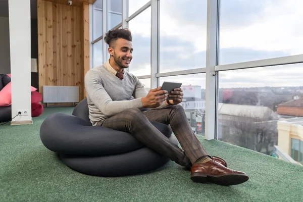 Hispanic Business Man Using Tablet Computer Sit n Front Panoramic Window Happy Smiling Businessman