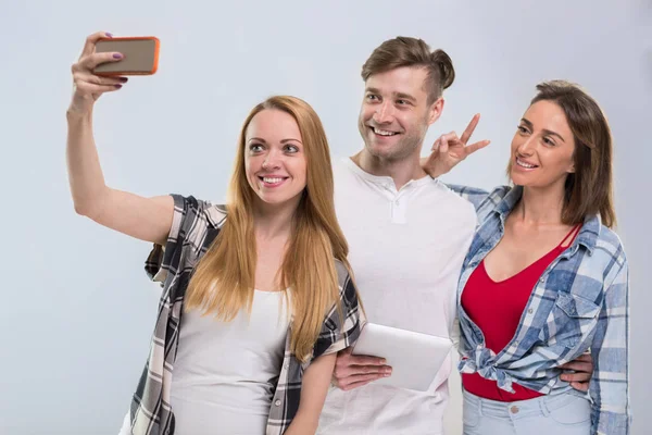 Casual People Group, Young Man Two Woman Happy Smile Taking Selfie Photo Cell Smart Phone Network Communication