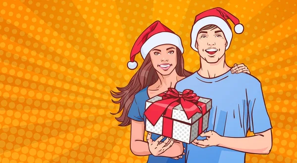 Coppia che indossa cappelli di Babbo Natale tenere regalo Happy Man And Woman On Comin Poster Pin Up Background Winter Holidays Concept — Vettoriale Stock