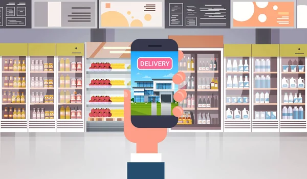 Ruka držící chytrý telefon v pořadí s potravinami produkty dodávky potravin v supermarketech koncept nákupu — Stockový vektor