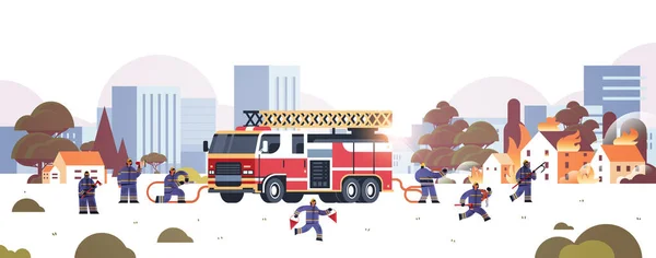 Firemen near fire truck getting ready to extinguishing fire firefighters in uniform and helmet firefighting emergency service concept burning houses cityscape background horizontal — Stock Vector