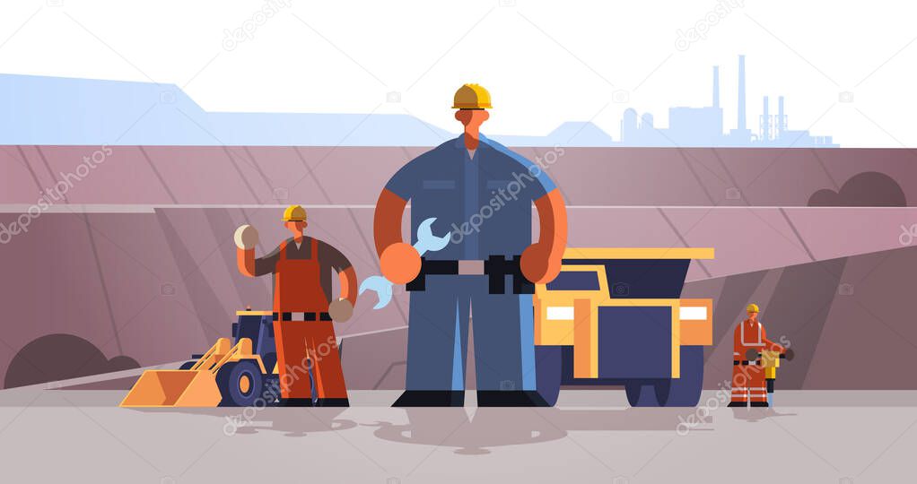 builders workmen using wrench and jackhammer industrial construction workers in uniform near mining transport building coal mine production concept opencast stone quarry background full length