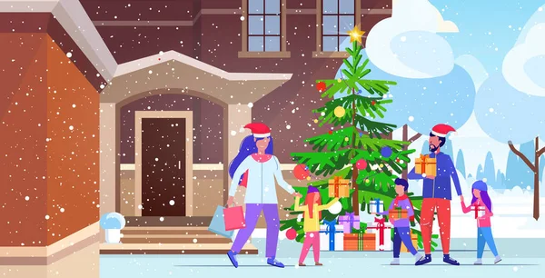 Rodina v Santa klobouky chůze venkovní rodiče a děti držení barevné nákupní tašky vánoční prodej zimní dovolená koncept moderní dům budova vnější horizontální plné délky — Stockový vektor