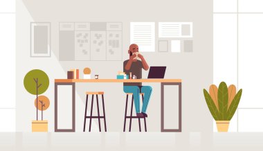 sick businessman blowing nose with handkerchief african american guy sitting at workplace using laptop man having flu sneeze illness concept modern office interior full length horizontal