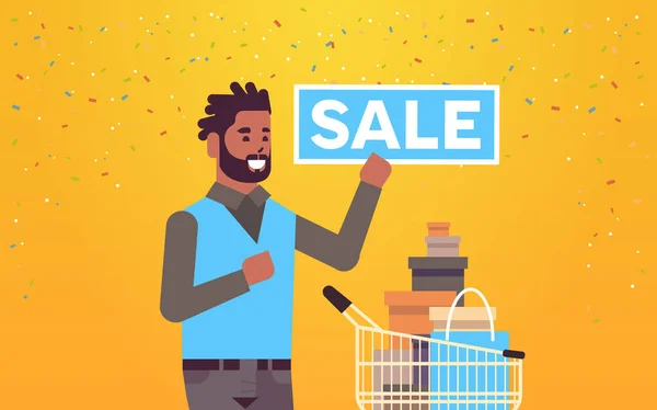 Man holding sale banner african american customer with trolley cart full of gift boxes special offer shopping concept flat portrait horizontal — 스톡 벡터