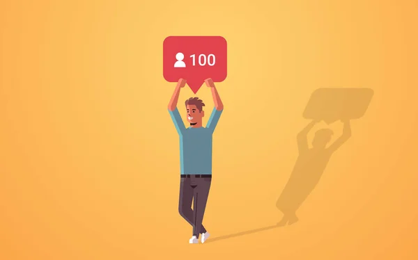 Man holding notification icon blogger excited about followers activity on social media networking blogging concept full length horisontal - Stok Vektor