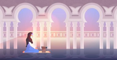 Dindar Müslüman kadın Ramazan 'da Kuran okurken kutsal ay dini kavramını kullanıyor.