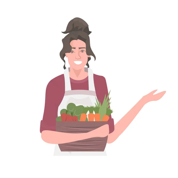 Belle femme jardinier panier d'exploitation avec légumes frais saine nutrition concept alimentaire éco végétalien — Image vectorielle