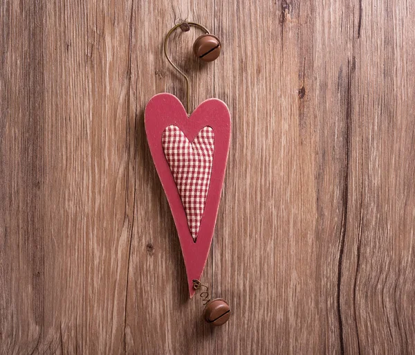 Christmas wooden decorations heart and christmas bell hanging on — Stock Photo, Image