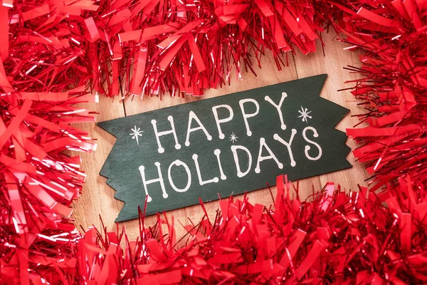 Heureux texte de vacances et décorations de Noël sur un backgr en bois — Photo
