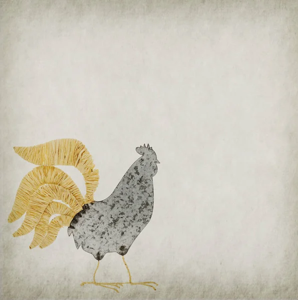 Rooster made of metal on old paper — Stock Photo, Image