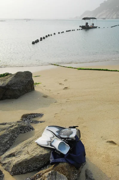 Pair of flippers for diving snorkeling or swimming in sea on roc — Stock Photo, Image