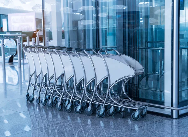 Luggage cart at modern airport.