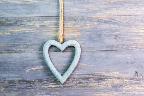 Blue heart on old shabby wooden background — Stock Photo, Image