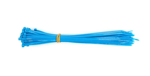 Blue plastic nylon cable ties closeup on white background — Stock Photo, Image