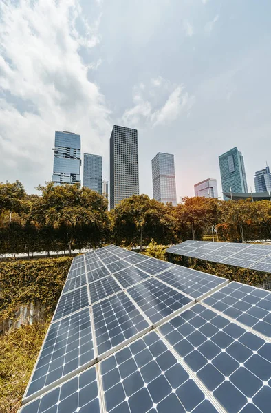 Ecological energy renewable solar panel plant with urban modern — Stock Photo, Image