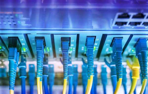 Fiber network cable connecting on network core switch close up — Stock Photo, Image