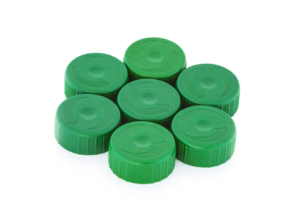 Siete tapas de botellas de plástico verde —  Fotos de Stock