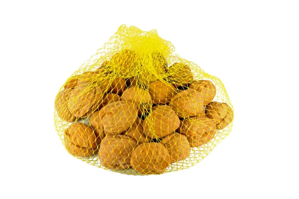 Walnuts in net bag — Stock Photo, Image