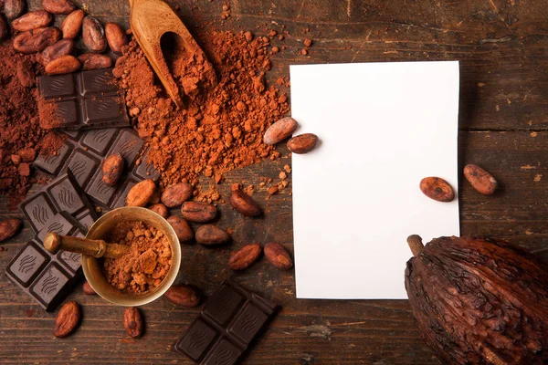 Dark chocolate on wooden table — Stock Photo, Image