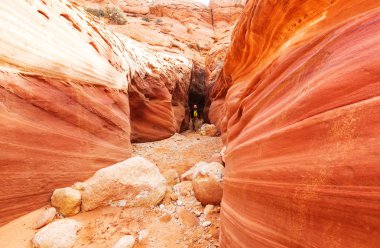 Hiker in Slot canyon clipart