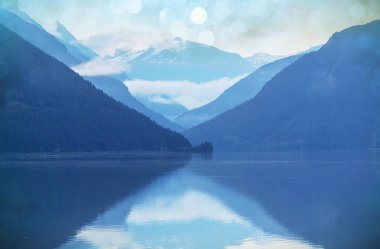 Serene scene by the mountain lake in Canada clipart
