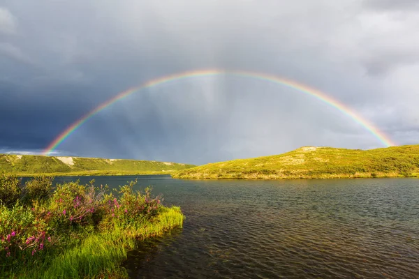Rainbow above mountains — Stock Photo, Image
