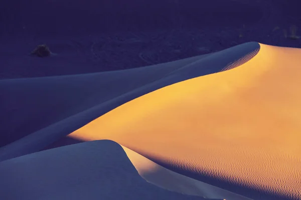 Beautiful sand dunes in desert at sunrise — Stock Photo, Image