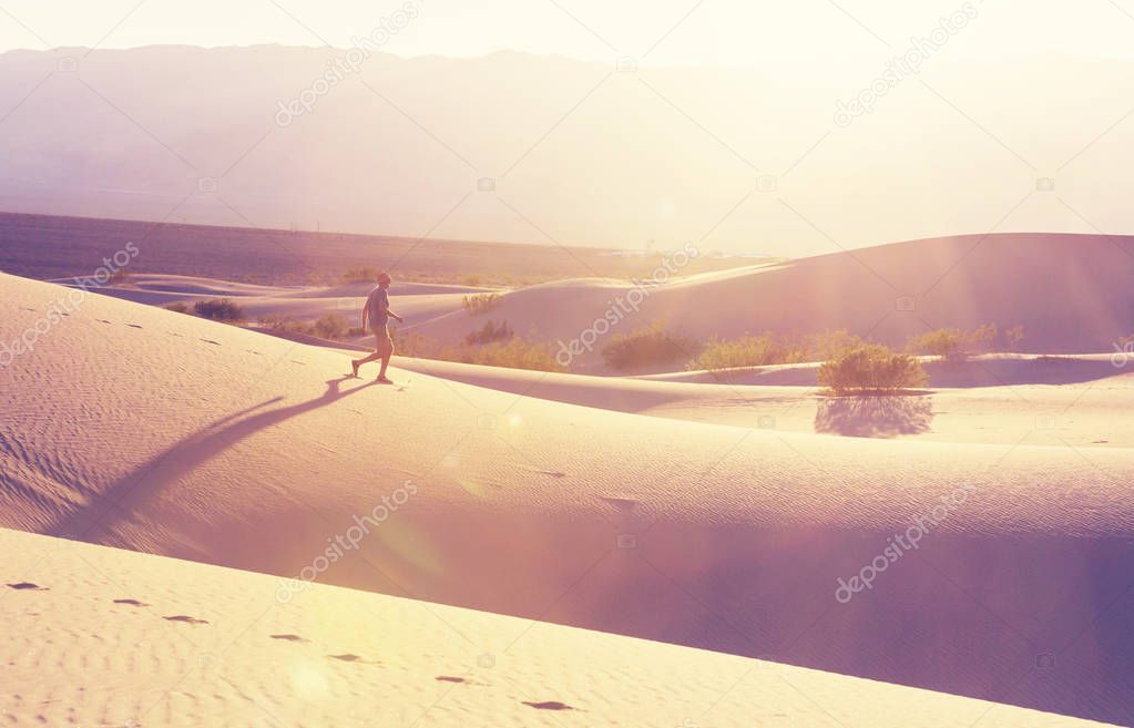 Hiker in sand desert.