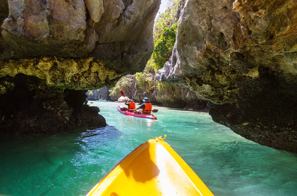 Kayak in the island lagoon between mountains