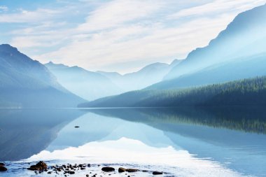 Beautiful Bowman lake with reflection of the spectacular mountains clipart