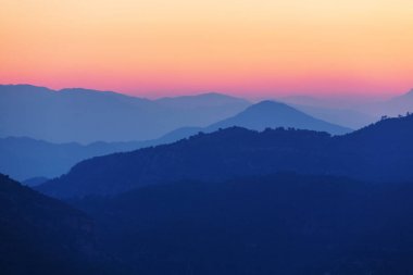 Scenic Sunset in the mountains clipart