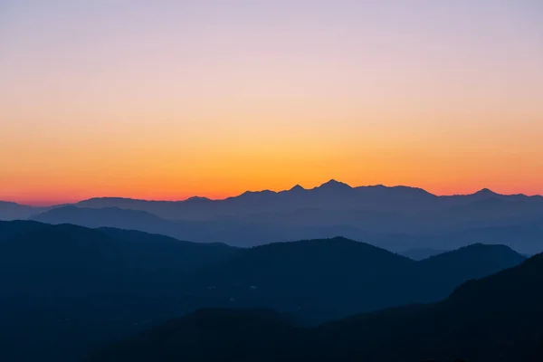 Mountains silhouette at sunset — Stock Photo, Image