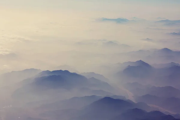 Mountains silhouette in clouds — Stock Photo, Image