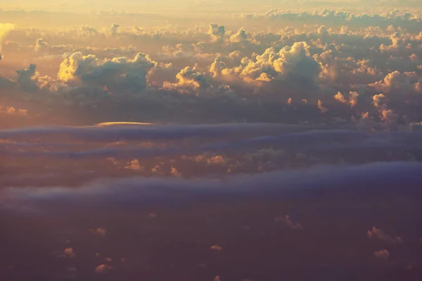 Beautiful view above clouds from the aircraft